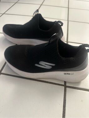 Skechers Black Slip-On Ultra Go Knit Sneakers with White Accents